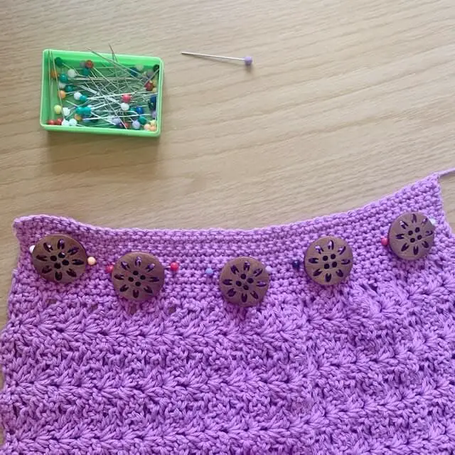 Calculate button placement for a crochet project
